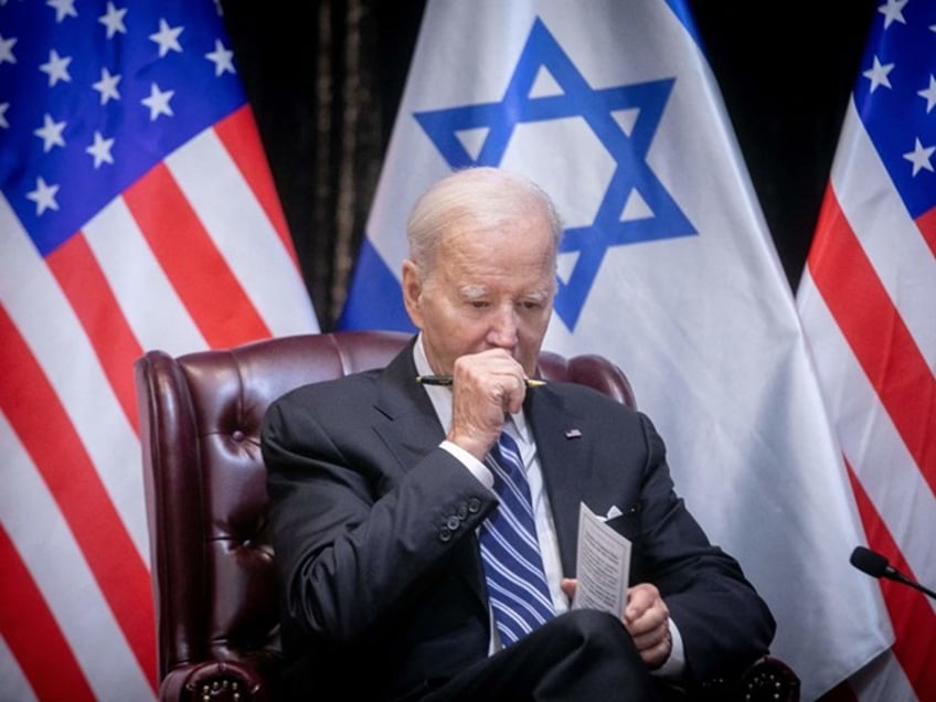 TOPSHOT - US President Joe Biden joins Israel's Prime Minister for the start of the Israeli war cabinet meeting, in Tel Aviv on October 18, 2023, amid the ongoing battles between Israel and the Palestinian group Hamas. US President Joe Biden landed in Tel Aviv on October 18, 2023 as Middle East anger flared after hundreds were killed when a rocket struck a hospital in war-torn Gaza, with Israel and the Palestinians quick to trade blame. (Photo by Miriam Alster / POOL / AFP) (Photo by MIRIAM ALSTER/POOL/AFP via Getty Images)