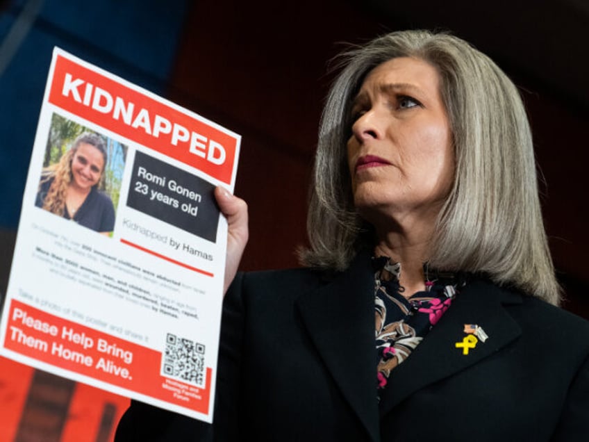 UNITED STATES - FEBRUARY 7: Sen. Joni Ernst, R-Iowa, holds a picture of Romi Gonen during