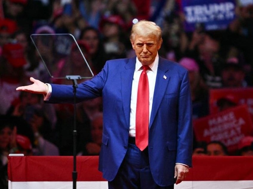 Former US President and Republican presidential candidate Donald Trump gestures after spea