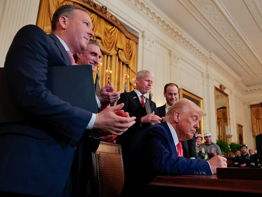 WASHINGTON, DC - APRIL 08: U.S. President Donald Trump signs a series of executive orders