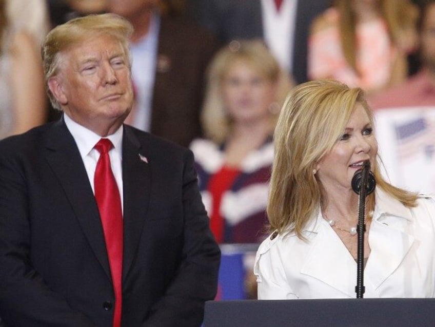 Representative Marsha Blackburn, a Republican from Tennessee, speaks as U.S. President Donald Trump, left, listens onstage during a rally in Nashville, Tennessee, U.S., on Tuesday, May 29, 2018. Trump is seeking to build a stable of Republicans who will help promote his agenda and serve as a check on Democrats …