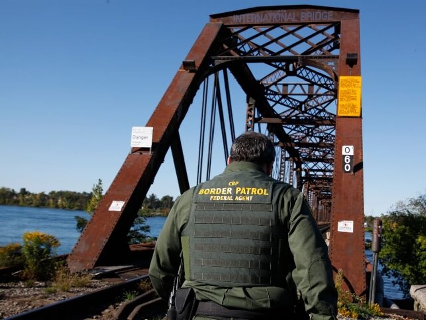 Senior Border Patrol Agent Sheldon Cooper monitors the International Railroad Bridge in Bu