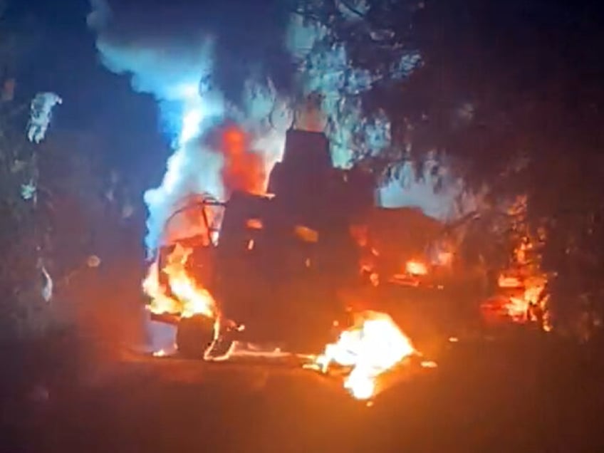 A police armored vehicle set ablaze by cartel gunmen just south of the Texas border. (Cred