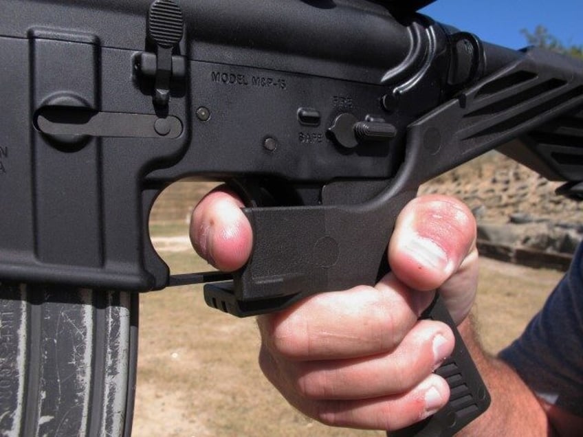 In this Oct. 4, 2017, file photo, shooting instructor Frankie McRae demonstrates the grip