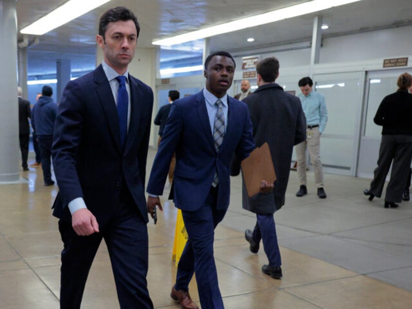Sen. Jon Ossoff (D-GA) (C) arrives at the U.S. Capitol on February 20, 2025 in Washington,