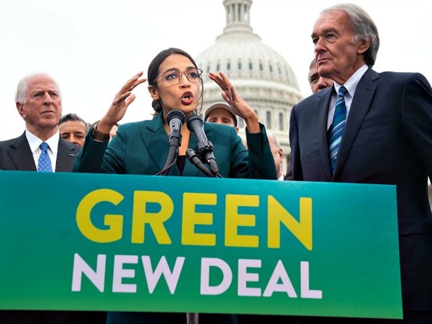 Rep. Alexandria Ocasio-Cortez and Sen. Ed Markey (right) speak during a press conference to announce Green New Deal legislation on Feb. 7. The resolution was introduced as a "first step" to put climate change at the top of Democrats' agenda. | Saul Loeb/AFP/Getty Images