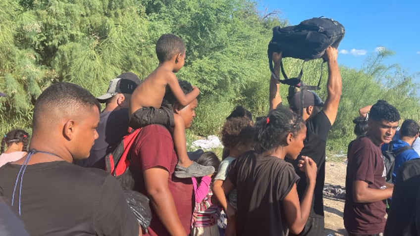 exclusive photos up to 3k migrants poised to cross into texas border town