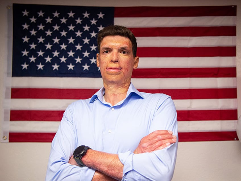 Republican U.S. Senate candidate Sam Brown stands for a photo at his campaign office on Ju