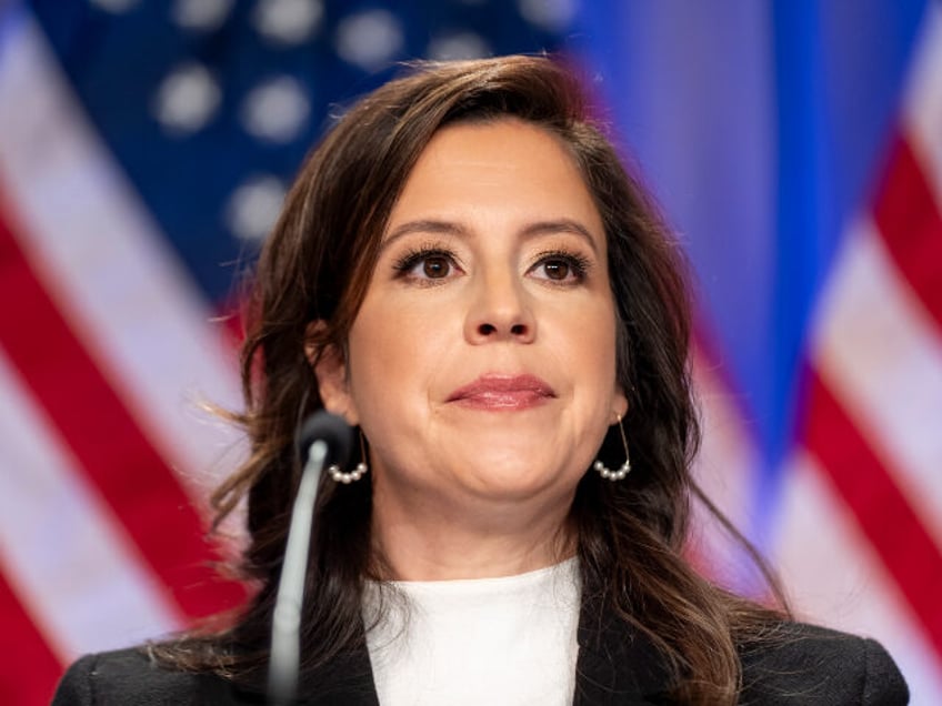 Rep. Elise Stefanik, R-N.Y., is seated before President-elect Donald Trump arrives at a me