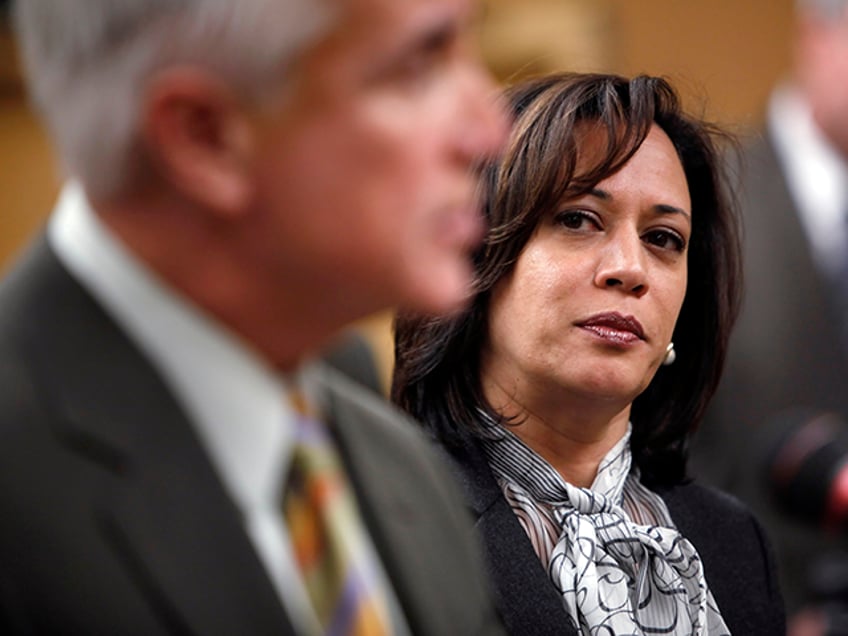 SF District Attorney Kamala Harris listens as SFPD Chief George Gascon addresses the press