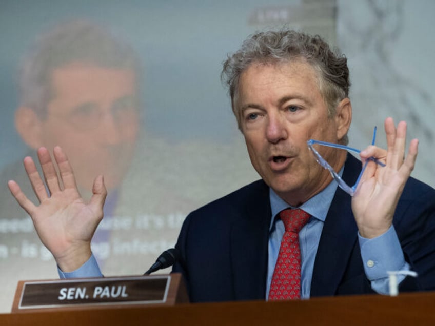 Sen. Rand Paul, R-Ky, questions Anthony Fauci, Director, National Institute of Allergy and Infectious Diseases, National Institutes of Health, while displaying a video and poster of Fauci, during the Senate Health, Education, Labor, and Pensions hearing to examine stopping the spread of monkeypox, focusing on the Federal response, in Washington, …