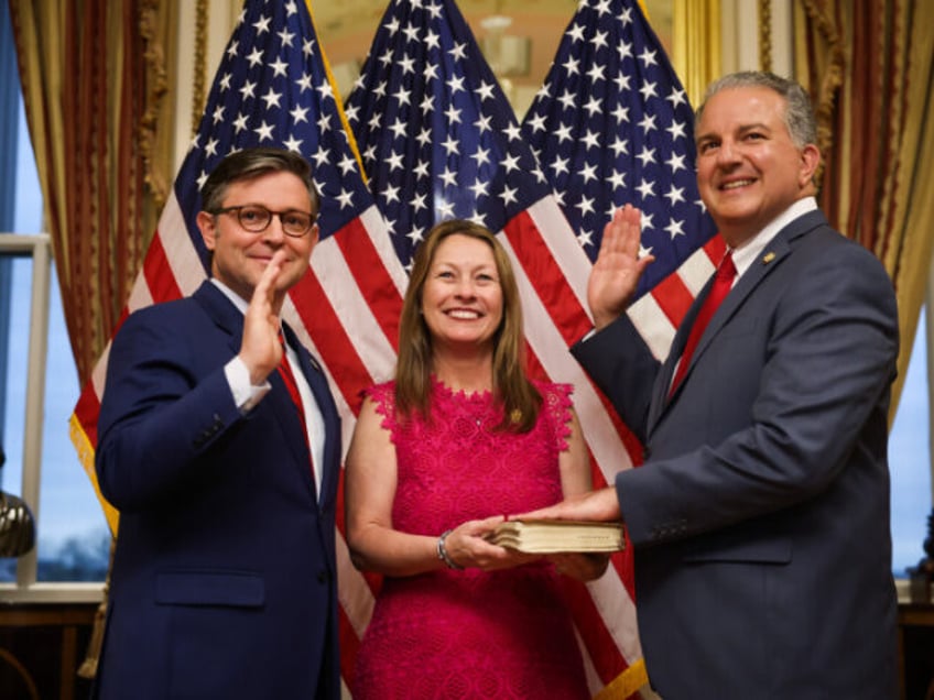 U.S. Speaker of the House Rep. Mike Johnson (R-LA) (L) participates in a ceremonial sweari