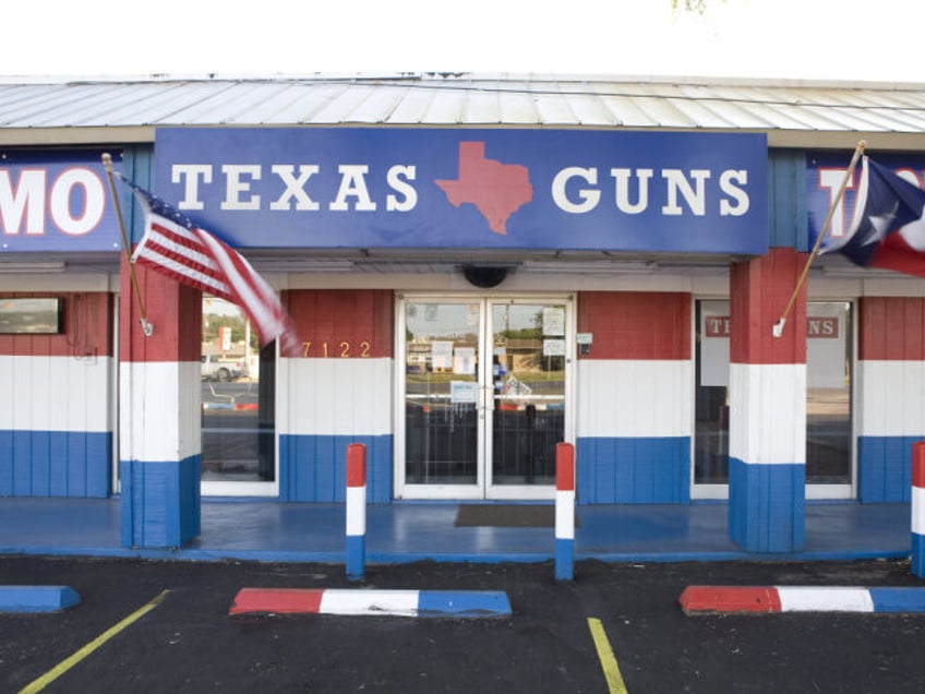 A sign indicates Texas Gun, one of the 6,700 gun dealers located near the 2,000 miles long