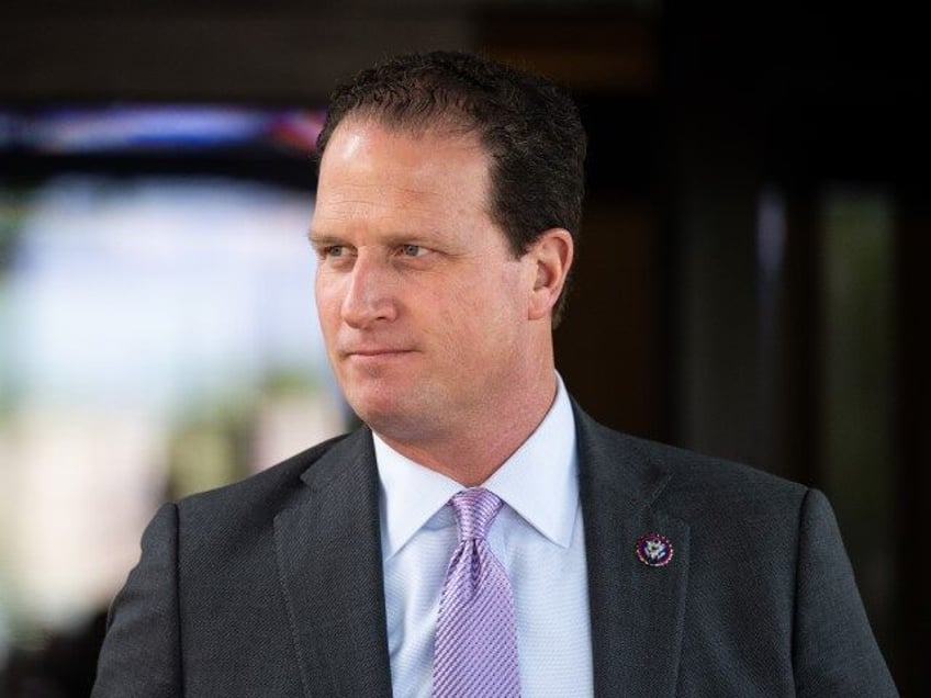 Rep. August Pfluger, R-Texas, leaves the House Republicans' caucus meeting at the Cap