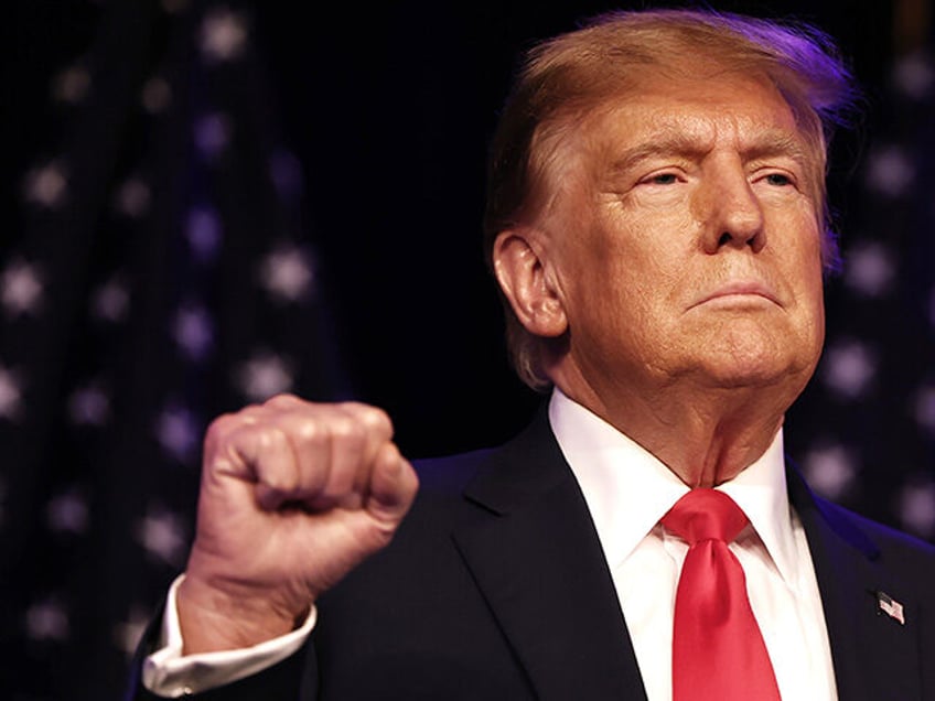 Republican presidential candidate and former U.S. President Donald Trump greets supporters at his c