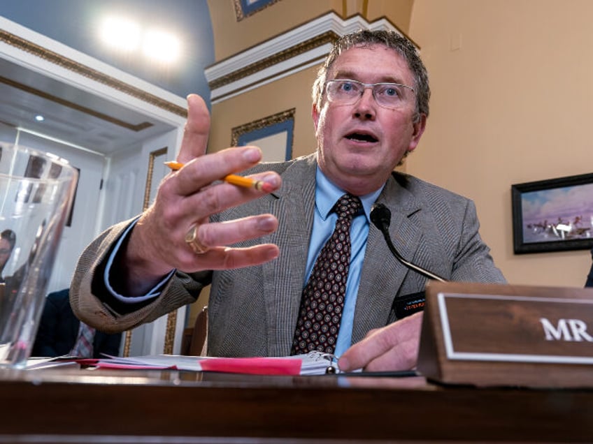 Rep. Thomas Massie, R-Ky., joined at right by Rep. Ralph Norman, R-S.C., both members of t