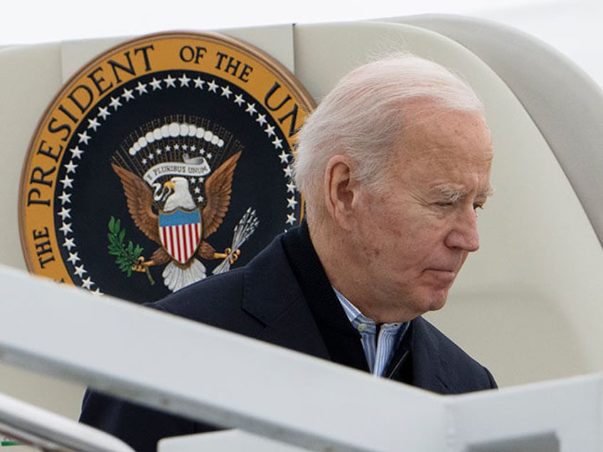 President Joe Biden arrives at Delaware Air National Guard Base in New Castle, Del., with first lady Jill Biden, Sunday, Dec. 17, 2023. (AP Photo/Manuel Balce Ceneta)