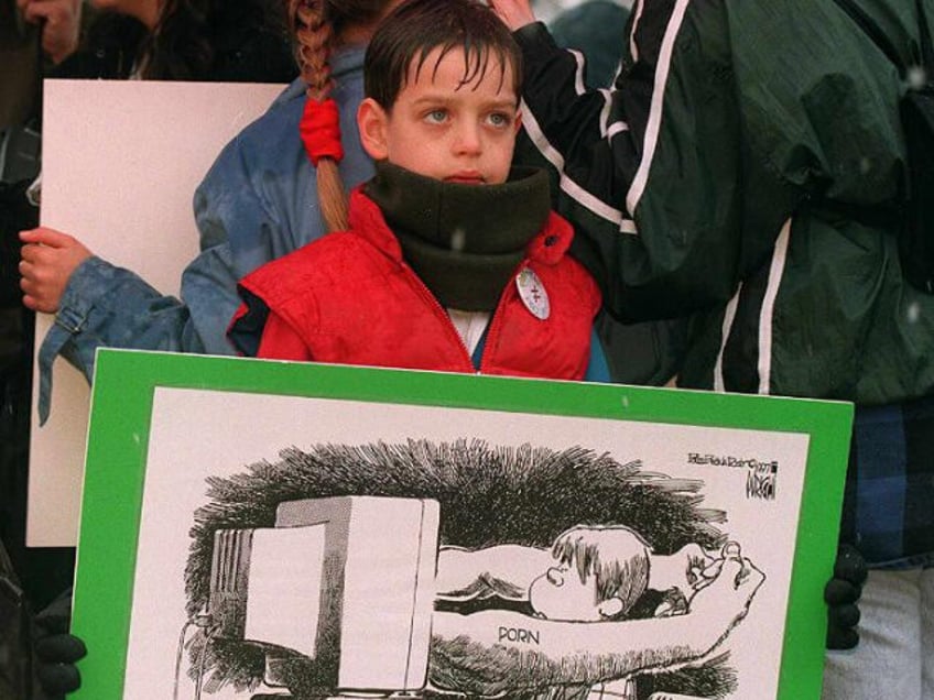 Seven-year-old Mark Rayer of Fairfax, VA protests child pornography on the Internet 19 Mar