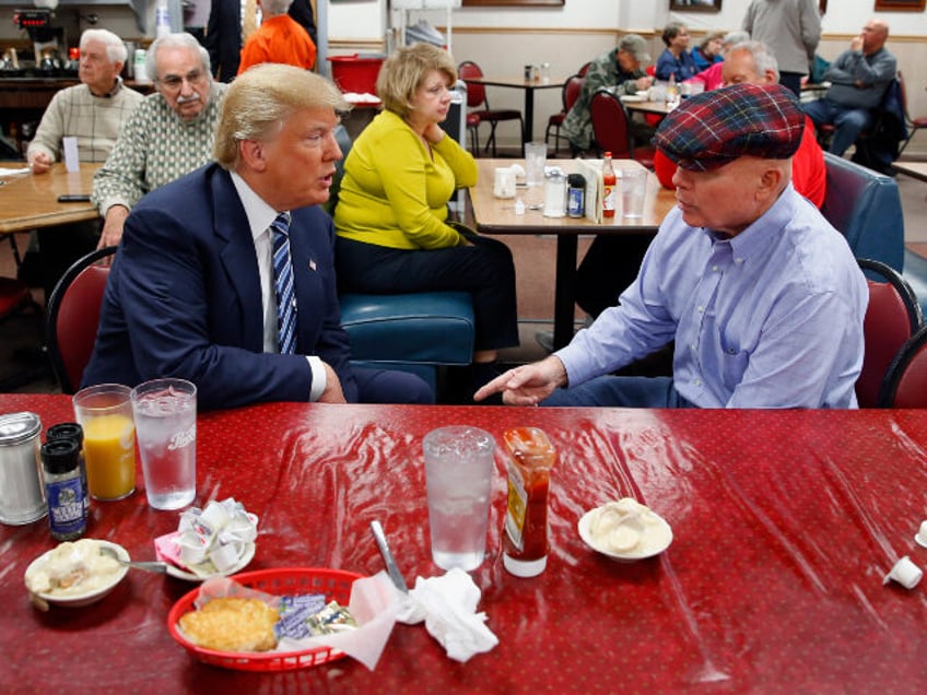 Republican presidential candidate Donald Trump talks with Retired Marine Col. Mike Stahl a