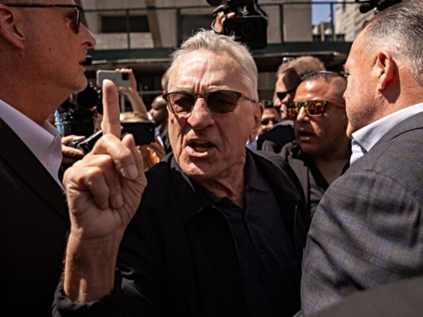 Actor Robert De Niro, center, points to a supporter of former US President Donald Trump, n