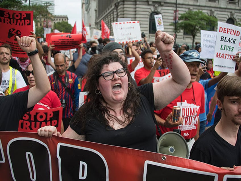 Anti-Donald Trump protesters march through the streets in Cleveland, Ohio, near the Quicke