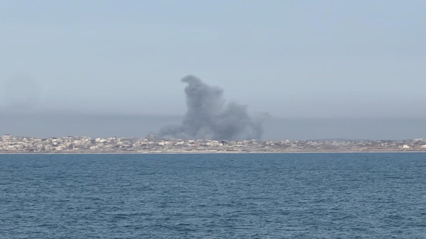 PHOTO: Smoke fills the air after a mortar was fired near the coast of the Gaza where the pier is attached. (U.S. Source Involved in the Mission)