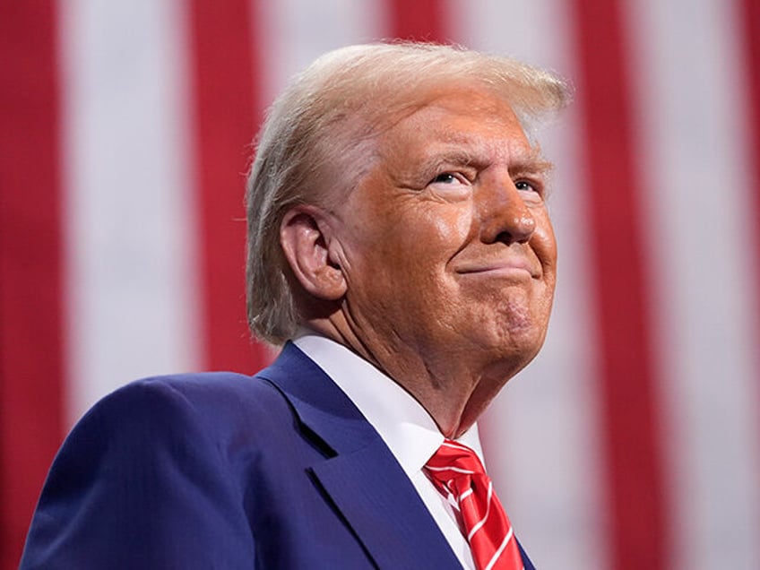 Republican presidential nominee former President Donald Trump pauses as he speaks at a cam