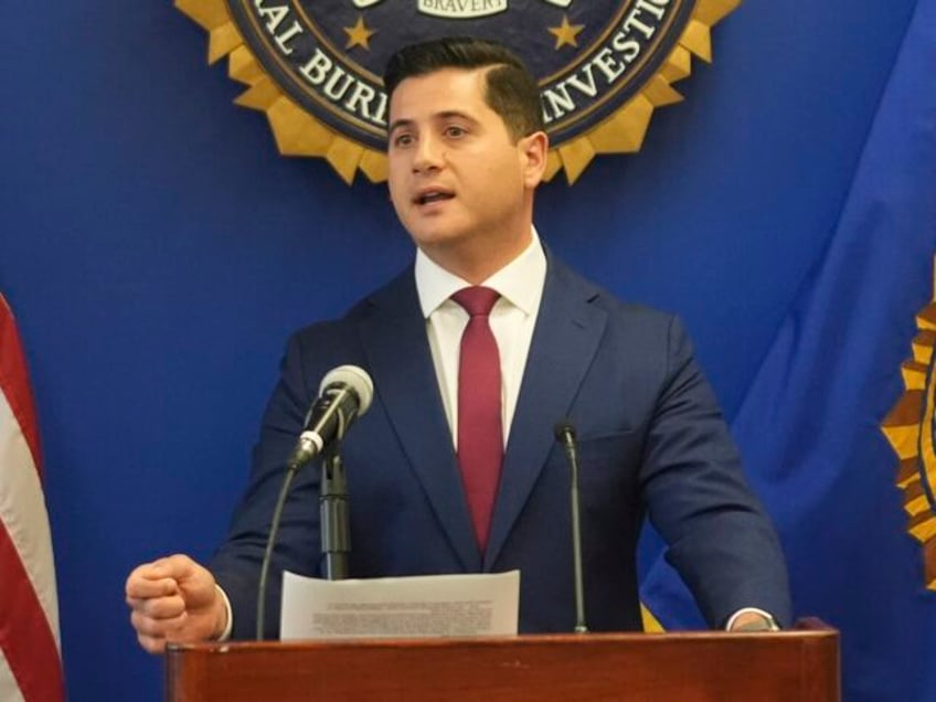 U.S. Attorney Bill Essayli, at podium with Akil Davis is the Assistant Director in Charge