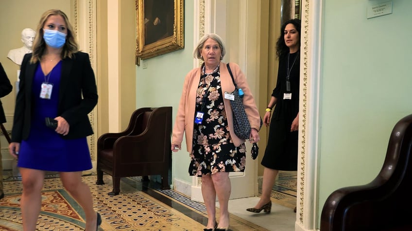 Anita Dunn, center, in July 2021 White House shot