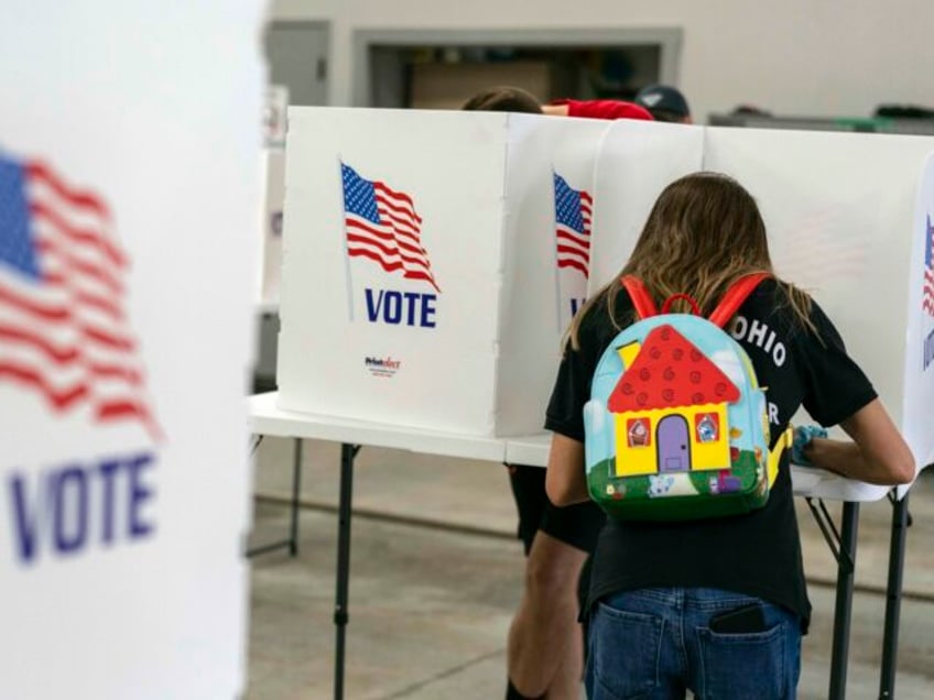 A voter fills out a ballot at the Pleasant Township Fire Department on Election Day, Tuesd