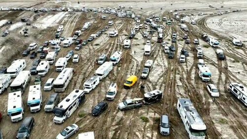 exodus begins thousands attempt to flee burning man