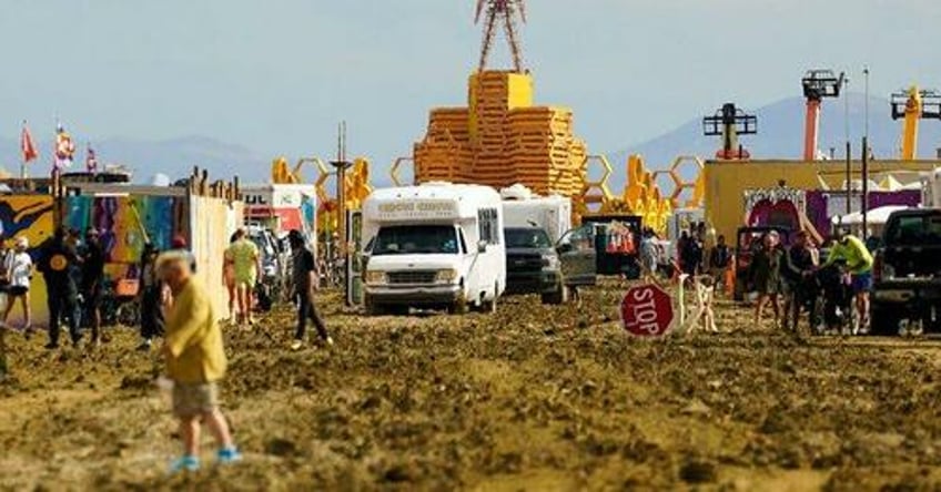 exodus begins thousands attempt to flee burning man