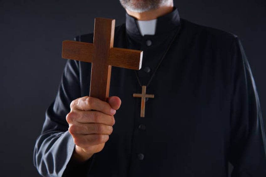 priest holding cross of wood praying - catholic priest demons stock pictures, royalty-free photos & images