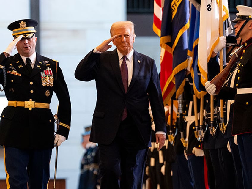 President Donald Trump reviews the troops in Emancipation Hall of the U.S. Capitol during