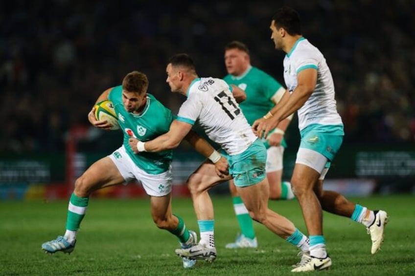 South Africa centre Jesse Kriel (2nd L) tackles Ireland fly-half Jack Crowley during the f