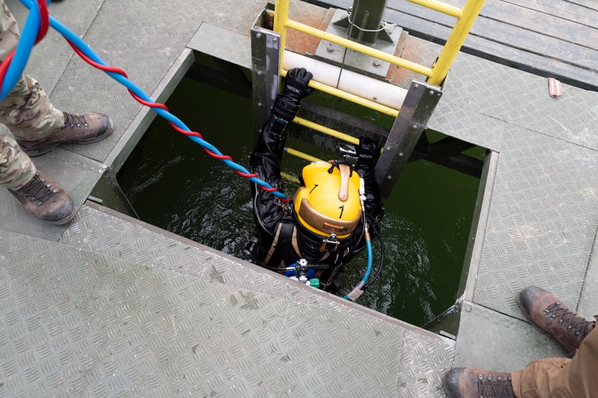 explosives disposal international military divers train together in flooded hungarian mine