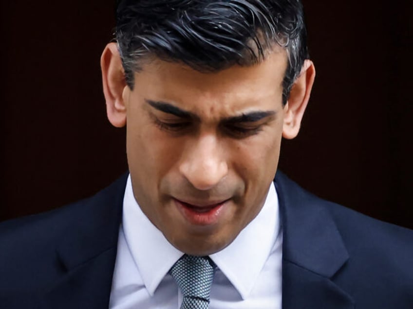 Britain's Chancellor of the Exchequer Rishi Sunak reacts as he leaves the 11 Downing Street, in London, on March 23, 2022. - Rishi Sunak will announce budget updates before parliament at about 1245 GMT, on March 23, 2022. (Photo by Tolga Akmen / AFP) (Photo by TOLGA AKMEN/AFP via Getty …
