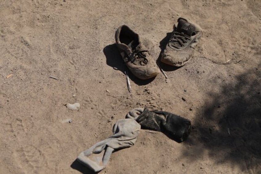 The personal belongings of migrants abandoned on the banks of the Rio Bravo, a natural bor