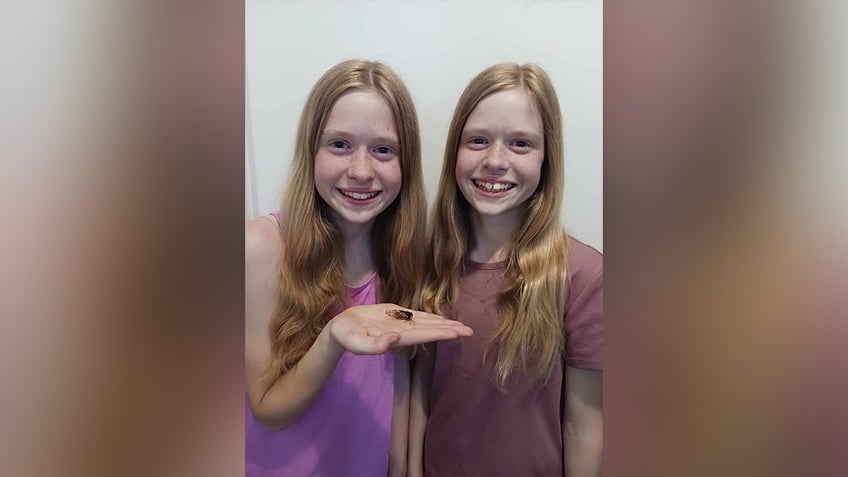 Two girls with the blue-eyed cicadas