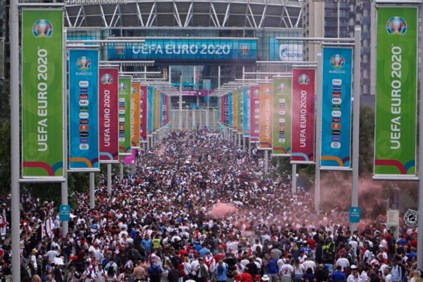 Unrest: Fans gather at Wembley Stadium ahead of a Euro 2020 final football match between E