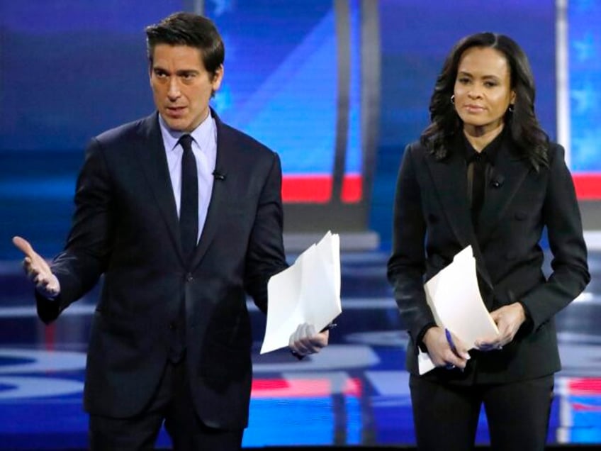 FILE - ABC World News Tonight Anchor David Muir, left, addresses members of the audience w