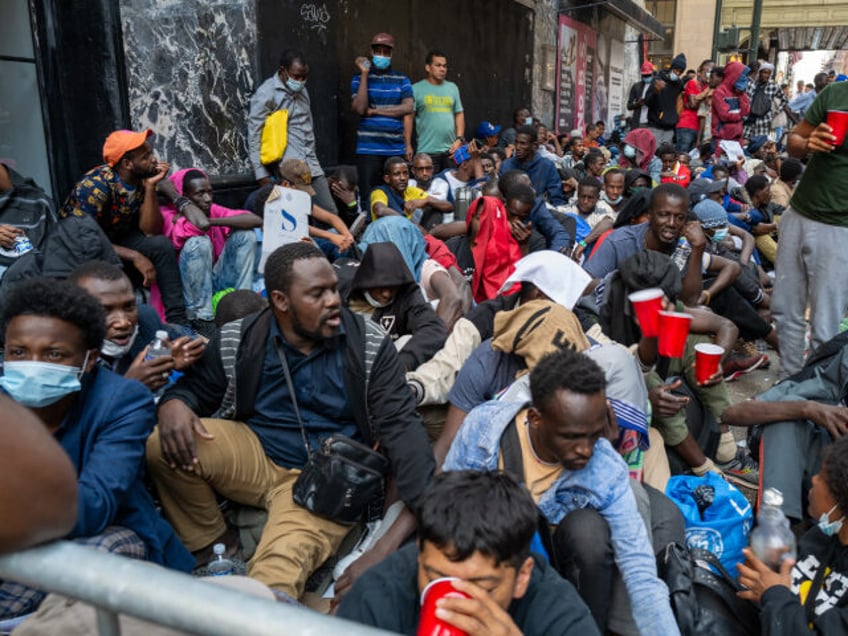 Migrants Wait Outside Midtown Hotel In Hopes Of Being Temporarily Housed