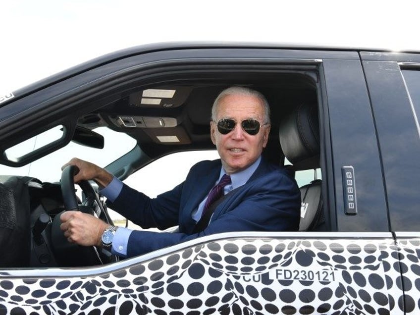 TOPSHOT - US President Joe Biden drives the new electric Ford F-150 Lightning at the Ford