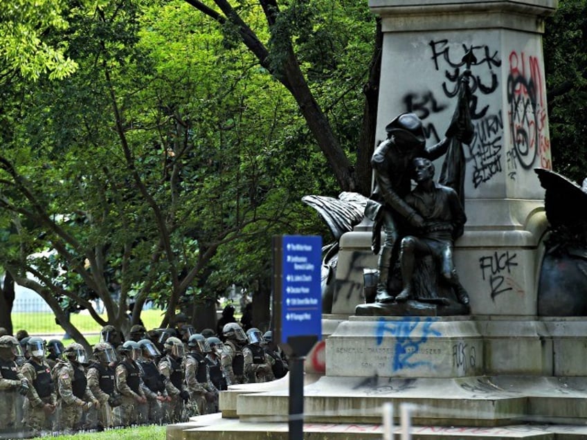 Police hold a perimeter at Lafayette Square near the White House as demonstrators gather to protest the killing of George Floyd on June 2, 2020 in Washington, DC. - Anti-racism protests have put several US cities under curfew to suppress rioting, following the death of George Floyd in police custody. (Photo by Olivier DOULIERY / AFP) (Photo by OLIVIER DOULIERY/AFP via Getty Images)