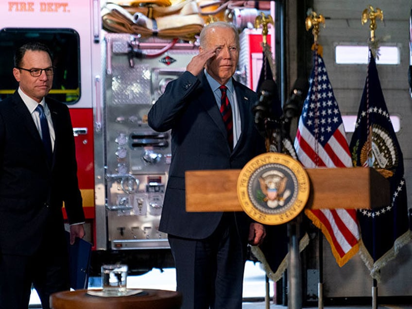 President Joe Biden, accompanied by Pennsylvania Gov. Josh Shapiro, left, salutes firefighters in the audience as he arrives at Engine 13 in Philadelphia, Monday, Dec. 11, 2023, for an event recognizing that the city of Philadelphia is receiving a 22.4 million dollar SAFER Grant, that enables the Philadelphia Fire Department …