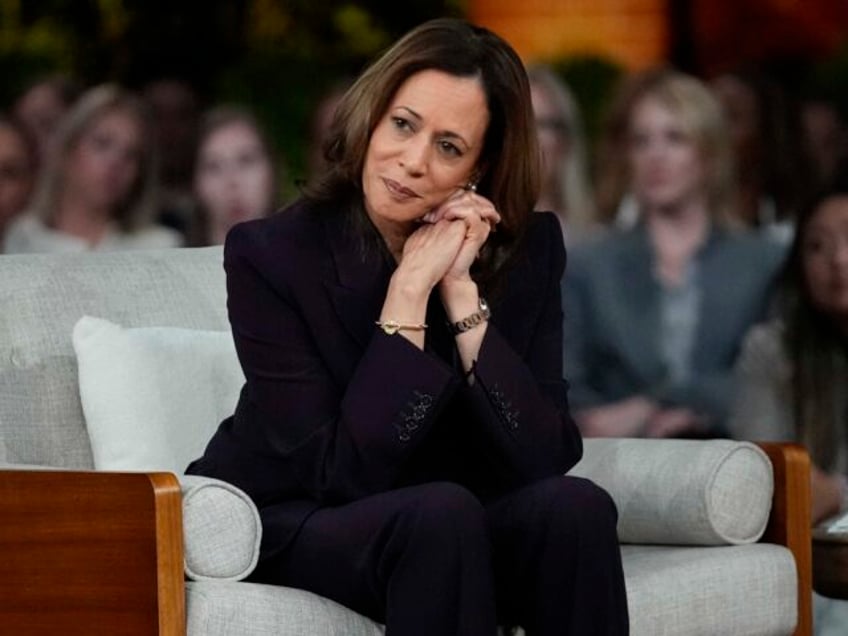 Democratic presidential nominee Vice President Kamala Harris listens to a parent's su