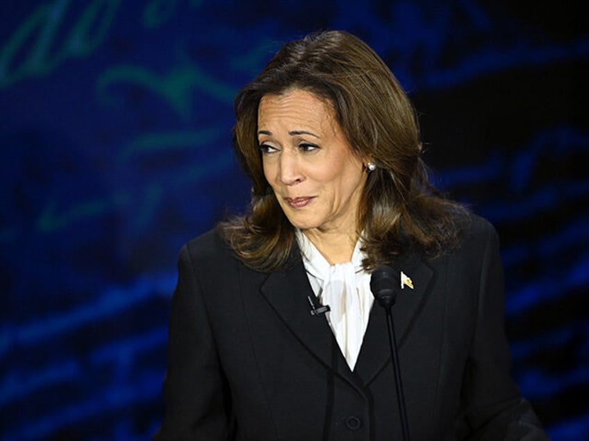 Vice President and Democratic presidential candidate Kamala Harris listens to former US Pr