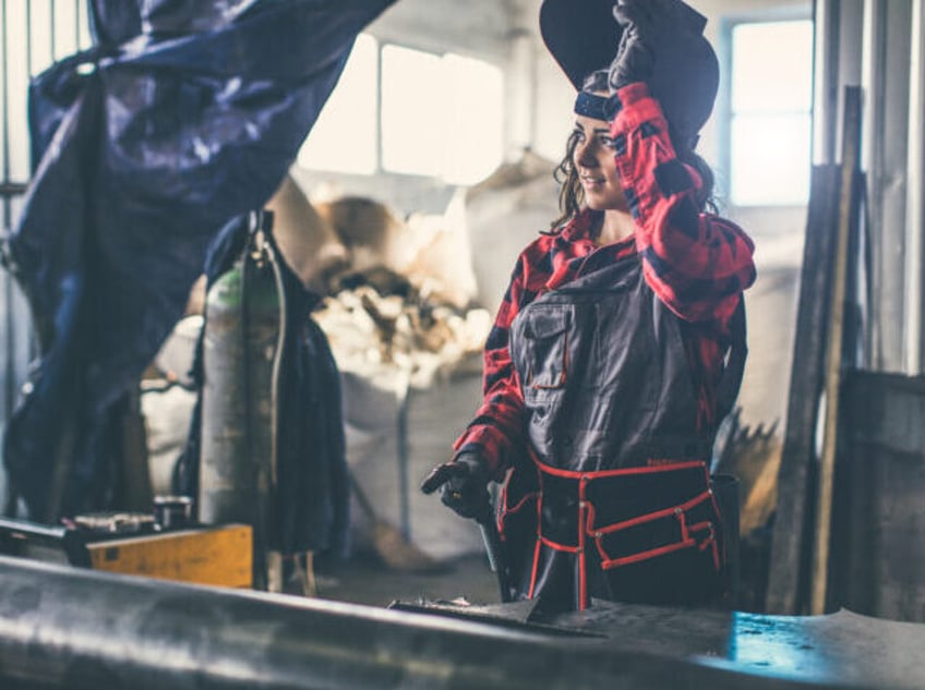 Industrial worker with welding tool