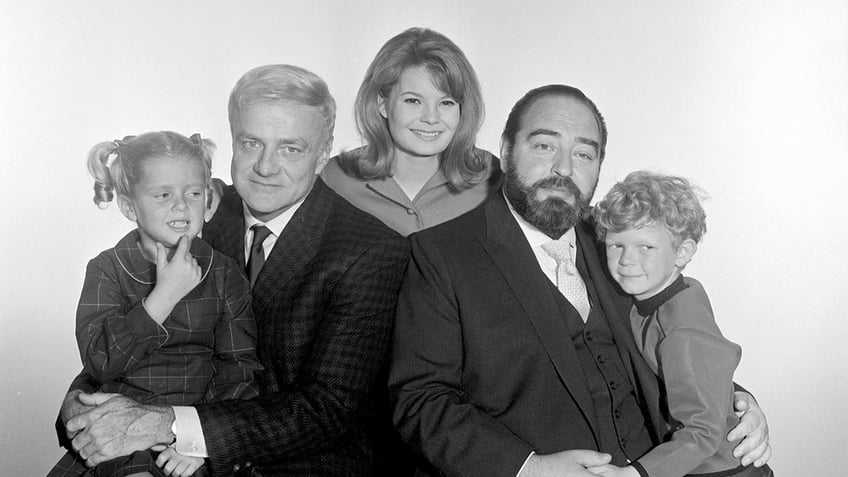 The cast of Family Affair smiling together for a promotional photo