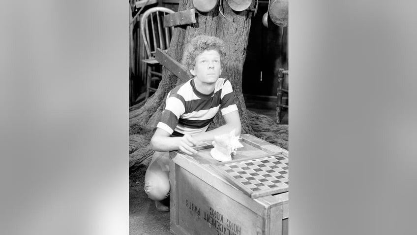 Johnny Whitaker playing checkers